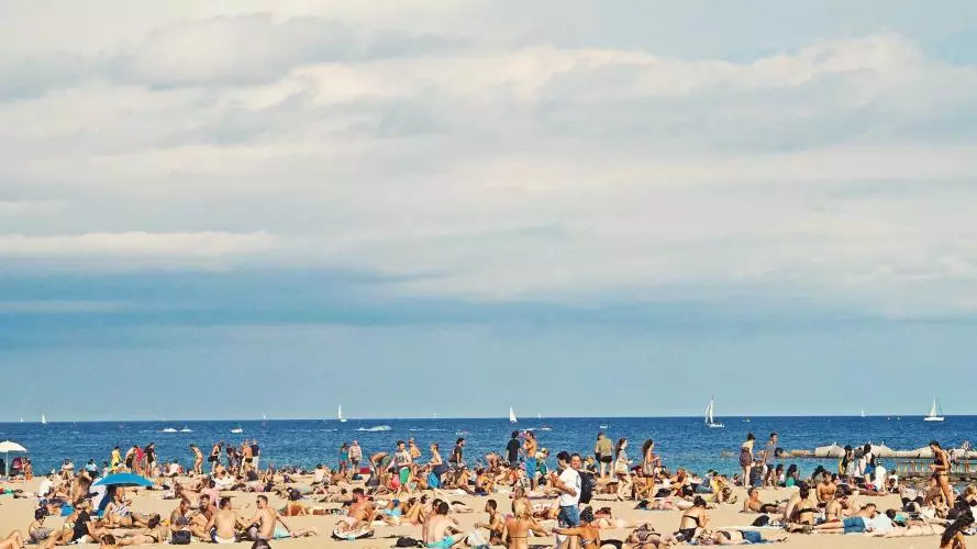 Crowds of people on a sunny beach