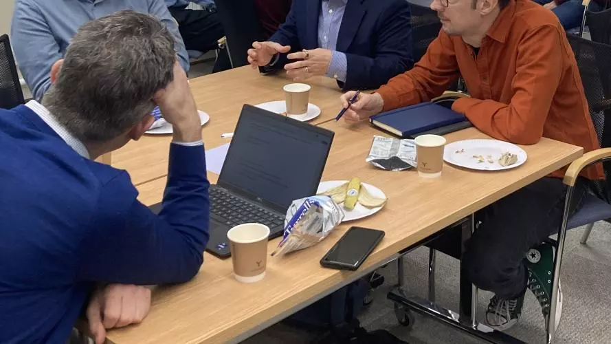 common ground seminar series  ai and society 13112023 researchers and academics sat around a table in discussion