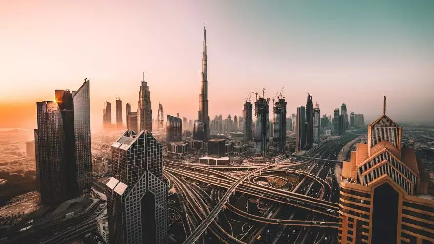 Aerial view of Downtown Dubai and Burj Khalifa, showing a complex intersection of several roads