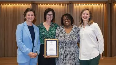 The VC (left) presents the Empowering People Award to Clare Oxenbury-Palmer (Law), Elisha Ward (SSD), and Anne Wolfes (Psychiatry)