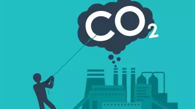 A cartoon person lassoes a big cloud labelled CO2 floating above a factor that's pumping out emissions