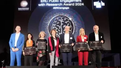 Professor Lucie Cluver on stage alongside fellow winners of the ERC Public Engagement Awards 2024