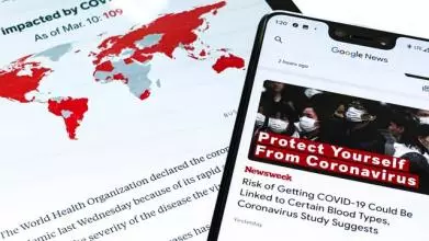 A Samsung Galaxy Tab S and Google Pixel 3XL show Coronavirus information