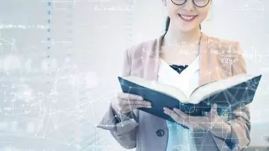 A young Asian woman smiles while reading a book, superimposed by numbers, calculations and graphs