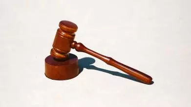 A wooden gavel and block