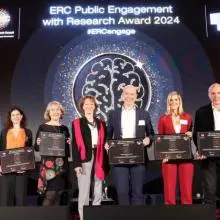 Professor Lucie Cluver on stage alongside fellow winners of the ERC Public Engagement Awards 2024